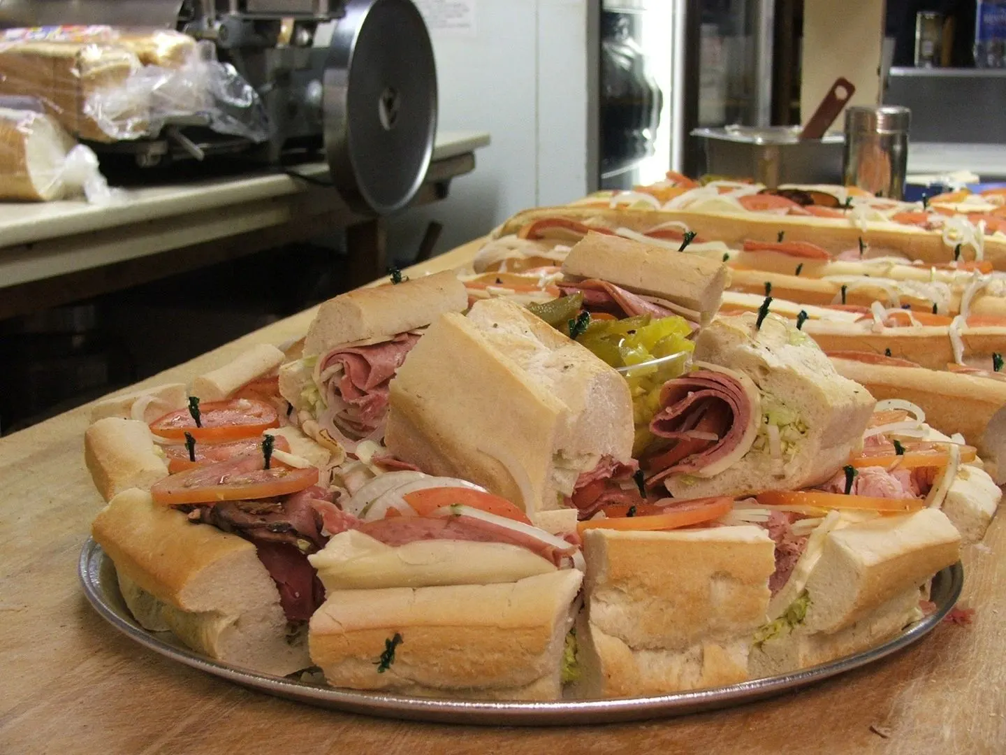 A platter piled high with Sugar Hill's Italian subs, cut and ready to share